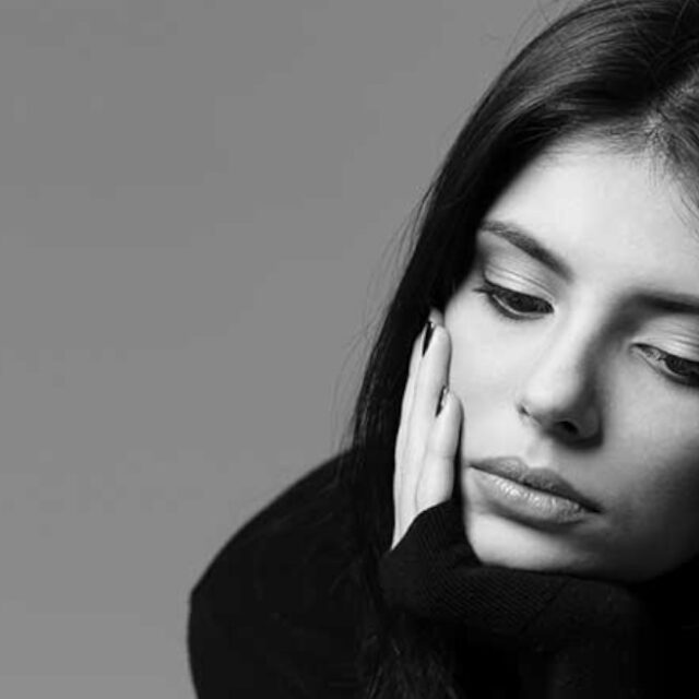 Young alone girl feeling sad